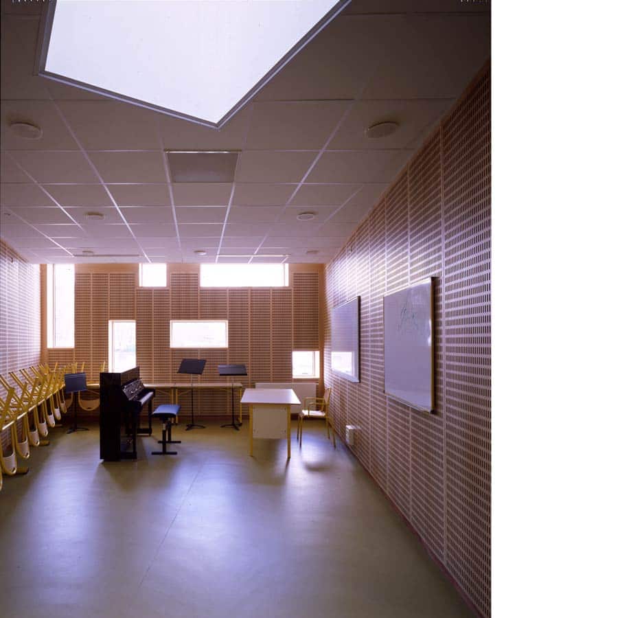 architecte CHAPUIS ROYER Vénissieux EQUIPEMENT école-de-musique béton brut zinc rue intérieure puits-de-lumière Rhône